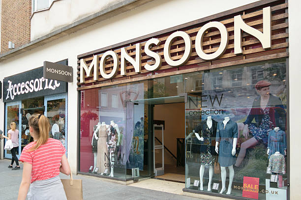 People walk by Monsoon Accesorize shops stock photo
