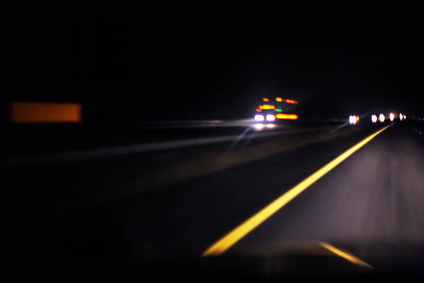 istock Intentional Blur Night Expressway Abstract Approaching Speeding Semi Trailer Truck 594487942