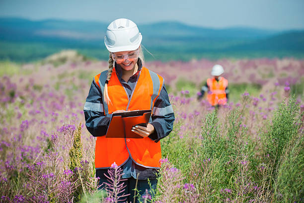 Researching recultivated field Man and woman researching recultivated field in russia ecologist stock pictures, royalty-free photos & images