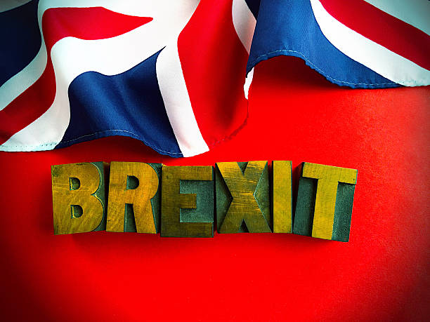istock Brexit word with part of British flag on red 594491960