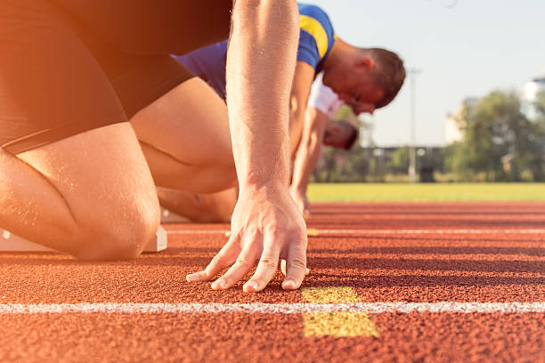 istock Male athletes at starting line 594492020