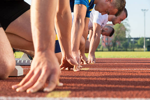 istock Male athletes at starting line 594492038