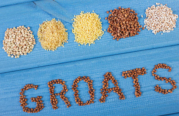 istock Inscription groats and various groats on wooden boards 594909192