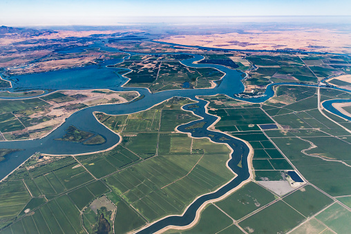 Numerous waterways snake through the delta where the Sacramento River and San Joaquin River meet.  Visible in the photo is Bethel Island, Franks Tract State Recreation Area, Mandeville Tip County Park, and Brannan Island State Recreation Area.