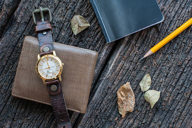 istock Old watch, bunch and the wallet on a wood background. 594912768