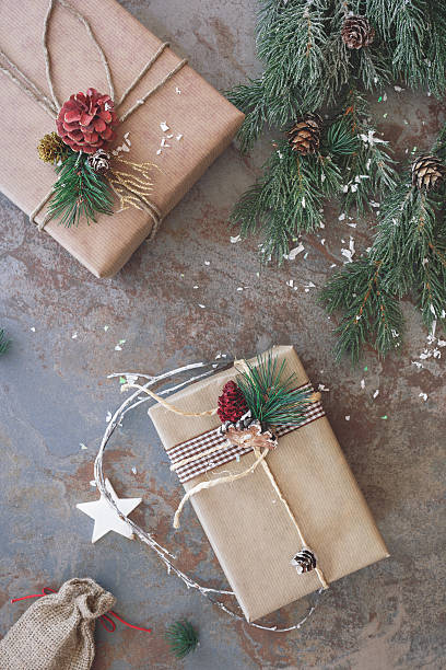 istock Christmas presents with fir tree and pine cone 594913726