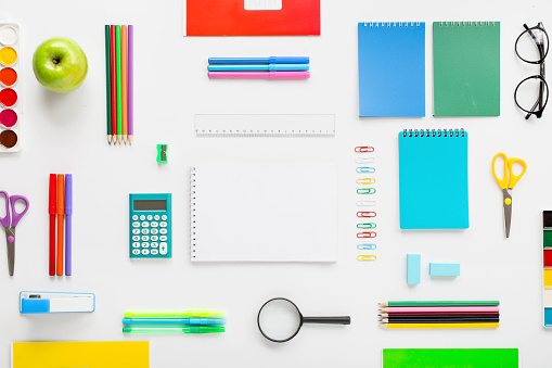 Set of school supplies on white background, top view