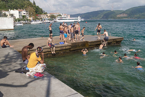 Istanbul, Turkey - August 19, 2016 : Turkish children are swim to cool off the coast of Sariyer.