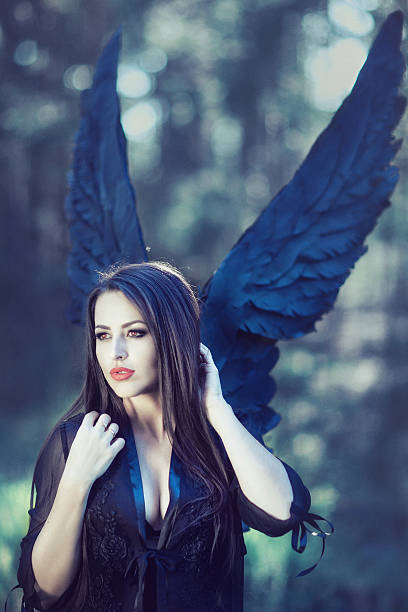 istock black angel in the forest 594918380