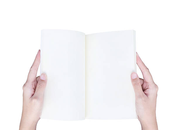 istock Closeup white book woman hand isolated on white background 594919092