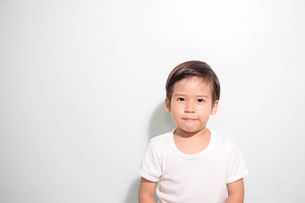 cute 3 years old Asian boy smile isolated stock photo