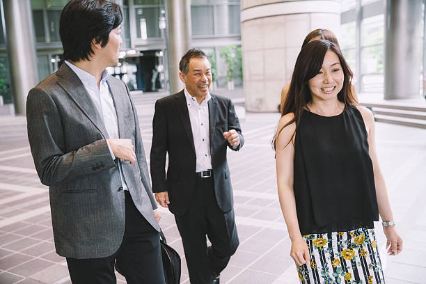 istock Businesspeople Talking and Walking 594922704