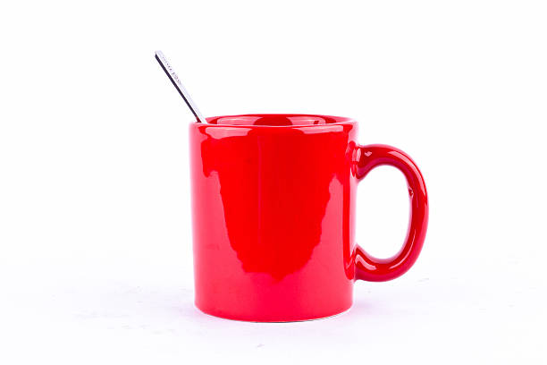 Red coffee or tea cup on blue background