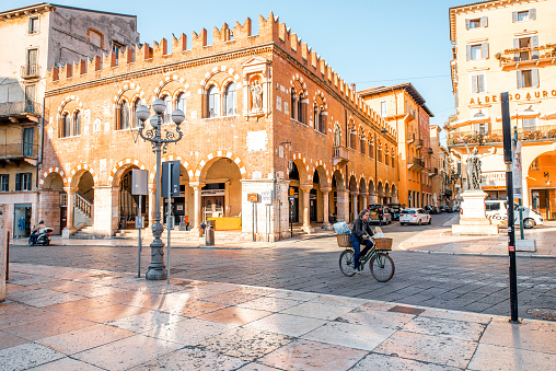 Verona, Italy - May 22, 2016: Morning life in the central square Erbe in Verona old town. City without tourists early in the morning