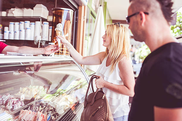istock Young Couple Buying Ice Cream 594924248