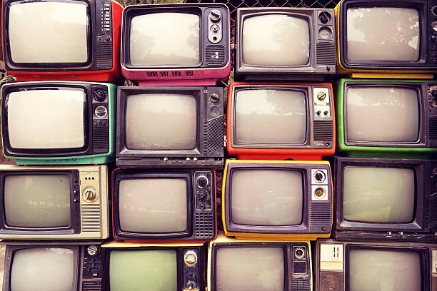 Retro TV Pattern wall of pile colorful retro television (TV) - vintage filter effect style. wall of monitors stock pictures, royalty-free photos & images