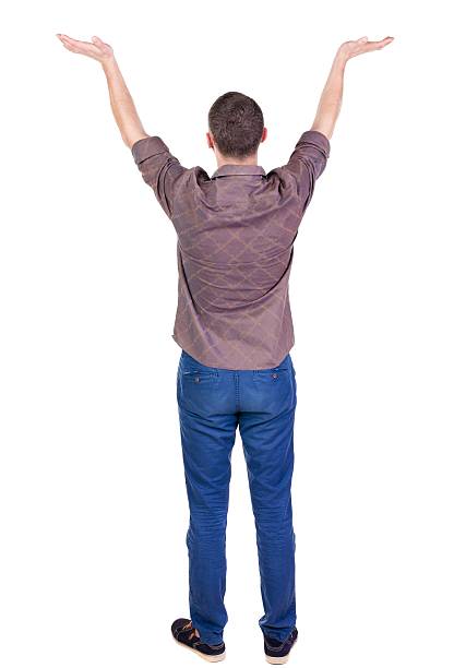 istock Back view of Beautiful man in jeans looking at wall 594927584
