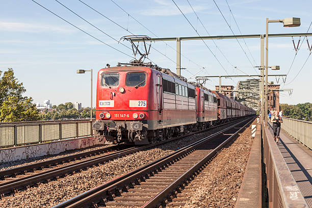 Red railcar pulls railroad wagonRed railcar pulls railroad wagon