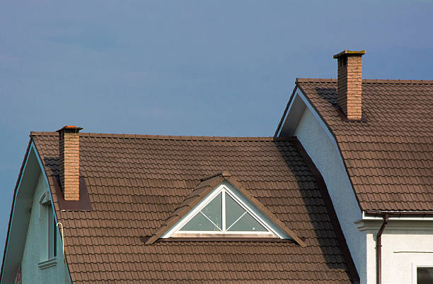 istock New house with attic window and rain gutter systems, chimney 594928720