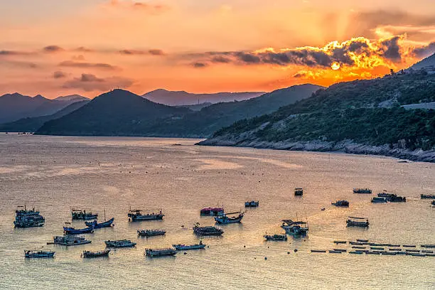17 August 2016,the fishing boats under the sunset docked at the beautiful coastal intertidal zone of xiaohao village in Xiapu.