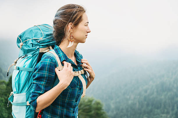 istock Beautiful hiker woman with backpack 594930756