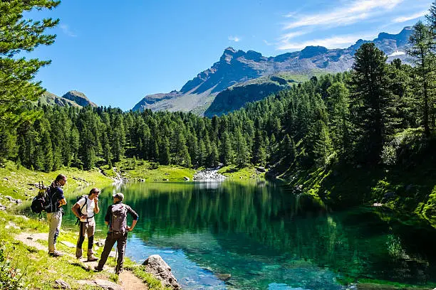 Hikers and mountain lake in the background