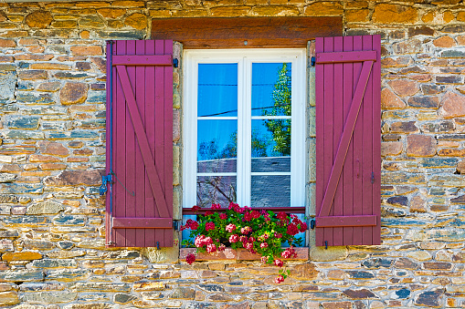 French Windows with Open Wooden Shutter Decorated with Fresh Flowers