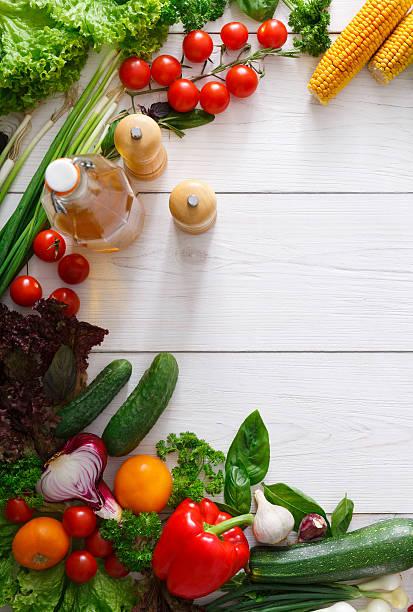 istock Fresh vegetables cooking background on white wood with copy space 594933666