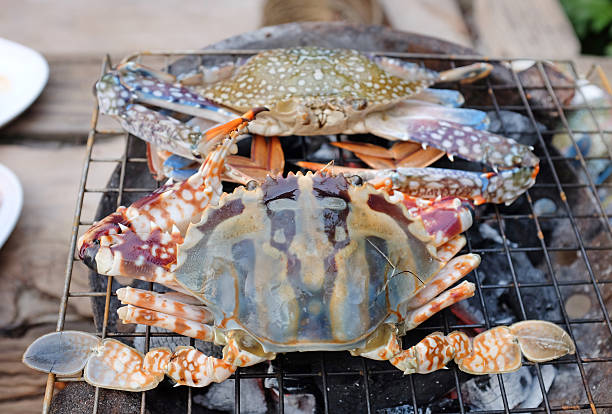 istock Fresh horse crab barbeque grilled on charcoal stove 594934364