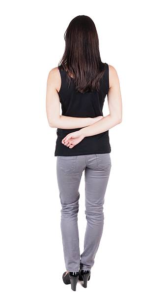 back view of standing young beautiful  brunette woman. girl  watching. Rear view people collection.  backside view of person.  Isolated over white background. 