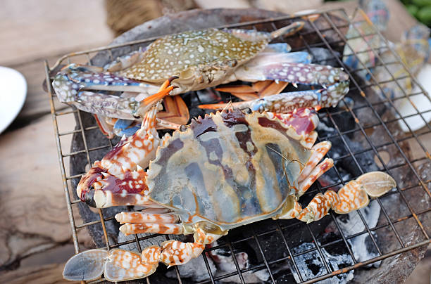 istock Fresh horse crab barbeque grilled on charcoal stove 594934486