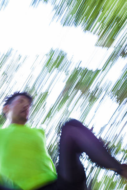 Young Japanese man streching in a mountain