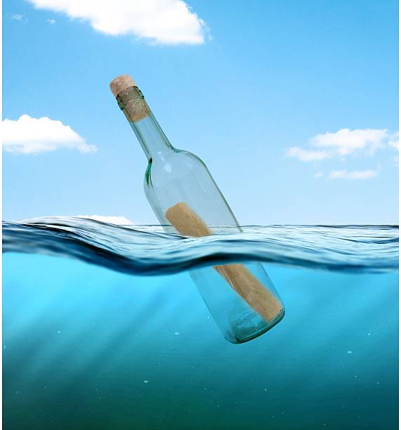 istock Bottle with a letter from the wreck 594937678