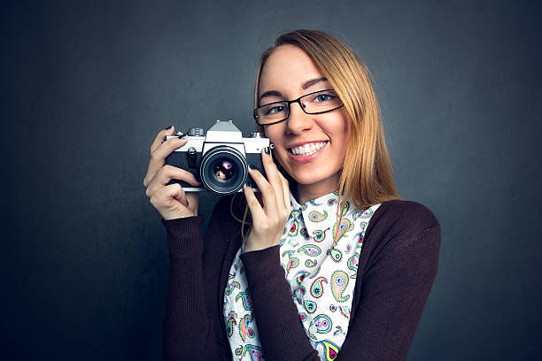 istock Cute girl with her camera 594941470