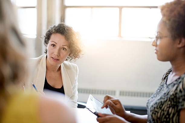 istock Unposed group of creative business people in an open concept 594941580