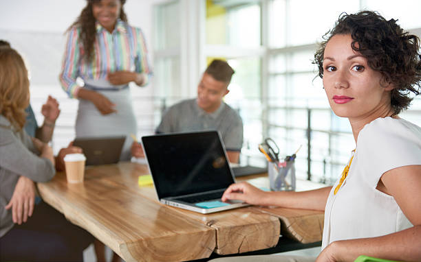 istock Image of a succesful casual business woman using laptop during 594941908