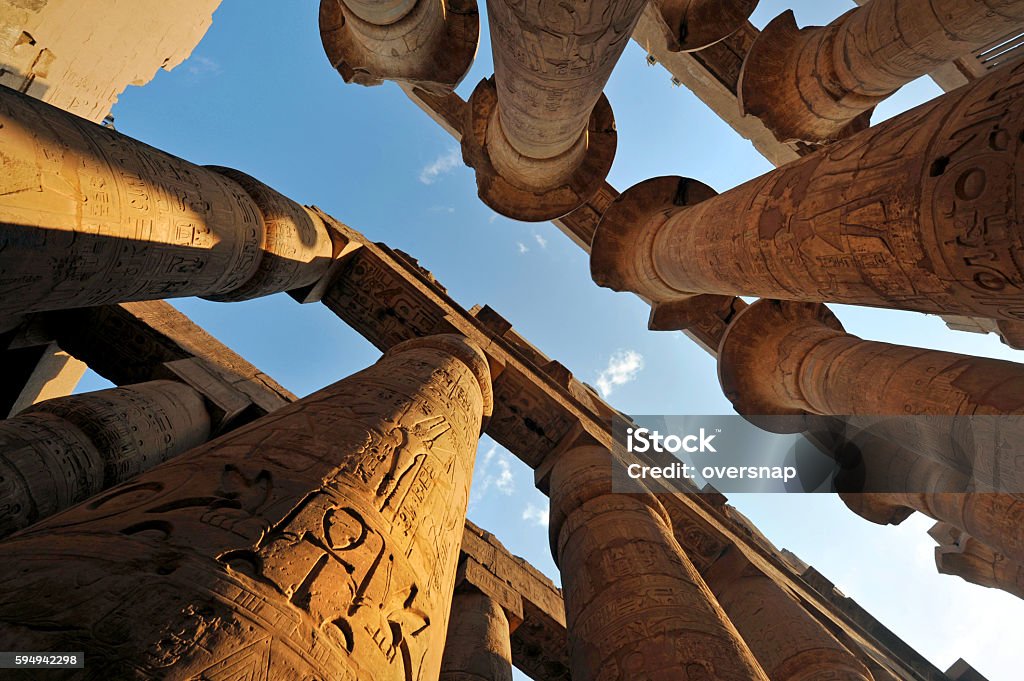 Ancient Egypt Sandstone pillers decorated with hieroglyphics at the Ancient Egyptian ( 2055 B.C ) temple of Karnak in Luxor Egypt Stock Photo