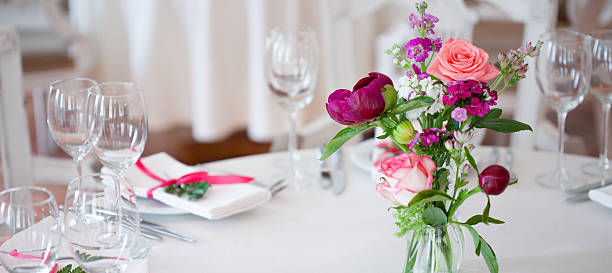 istock Wedding banquet, small restaurant floral, decor in red, informal style. 594944662