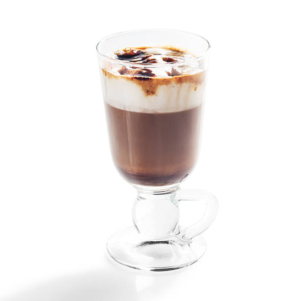 istock Irish coffee in glass isolated on white background 594944848