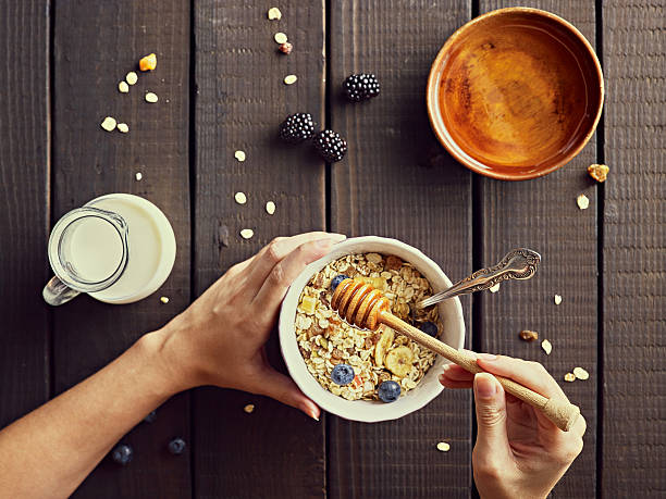 istock Preparing musli. Healty food concept. 594945248