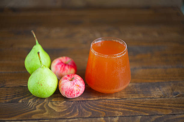 istock juice of pears and apples  in glass on  table 594945598