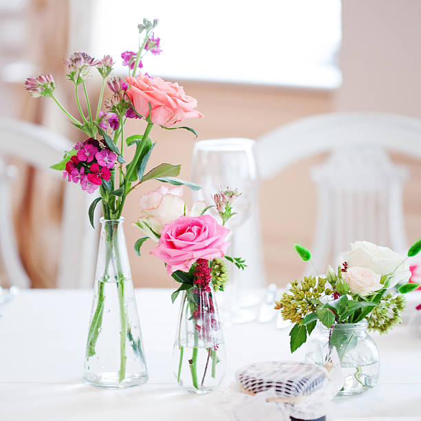 istock Wedding banquet, small restaurant floral, decor in red, informal style. 594946362