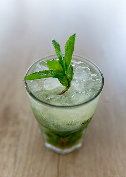 istock Mojito cocktail on wooden table 594946932