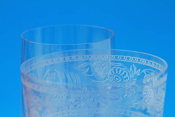 istock Macro closeup of crystal glass stemware with decorative etchings 594947144