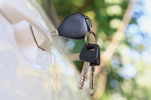 istock Car keys left in the car door 594948730