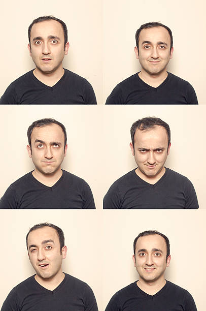 istock Young man making facial expressions 594949390