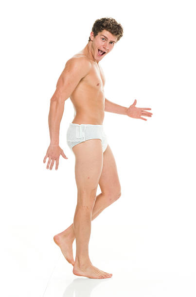 Shirtless muscular man walking Shirtless muscular man walkinghttp://www.twodozendesign.info/i/1.png adult diaper stock pictures, royalty-free photos & images