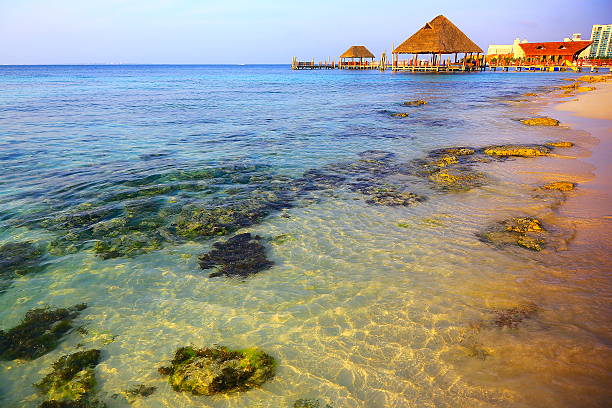 Rustic dock, Palapa - idyllic beach sunset – Cancun, Mexican caribbean