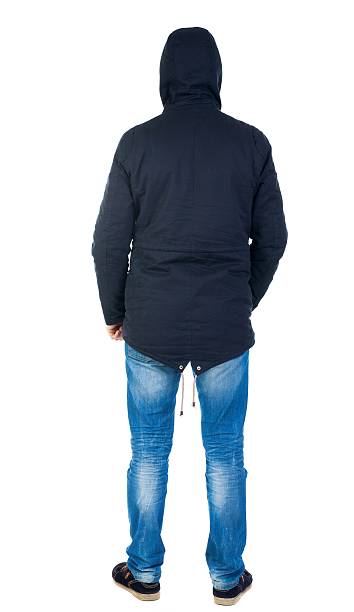 istock Back view of handsome man in winter jacket  looking up. 595104796