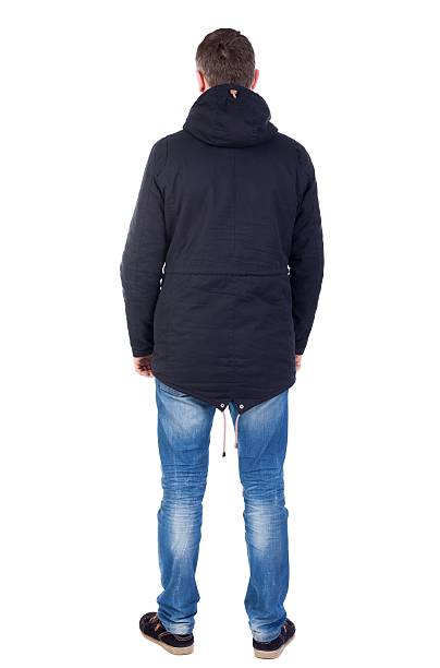 istock Back view of handsome man in winter jacket  looking up. 595105202